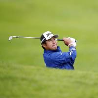 Hideki Matsuyama follows his shot from the bunker on the 10th hole during the second round of the Genesis Open on Friday. | AP