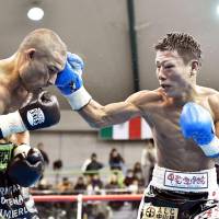 Tatsuya Fukuhara lands a punch on Mexico\'s Moises Calleros during their bout in Kamiakusa, Kumamoto Prefecture, on Sunday. | KYODO