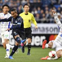 Gamba Osaka striker Ademilson shoots during his team\'s 1-1 draw with Ventforet Kofu at Suita Stadium in the J. League on Sunday. | KYODO