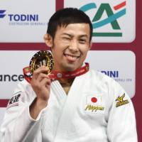 Naohisa Takato poses with his gold medal after winning the 60-kg category at Grand Slam Paris on Saturday. | KYODO