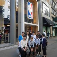 Mie Kajikawa (rear, second from left) poses with members of the Next Big Pivot training program in front of the NBA Store in New York during September of 2016. | NEXT BIG PIVOT