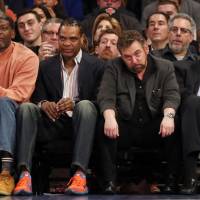 Knicks executive chairman James Dolan (second from right), seen with ex-Knicks Larry Johnson (left), Latrell Sprewell (second from left) and Bernard King during Sunday\'s game against the Spurs, faced a public backlash over his row with another ex-Knick, Charles Oakley. | USA TODAY / VIA REUTERS