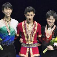 Four Continents champion Nathan Chen (center) stands with runner-up Yuzuru Hanyu (left) and third-place finisher Shoma Uno. | KYODO