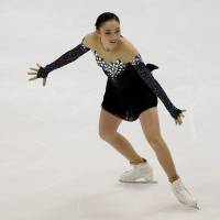 Rika Hongo competes on Saturday in the women\'s free skate at the Asian Winter Games. Hongo placed fourth in the competition. | REUTERS