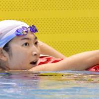 Rikako Ikee reacts after breaking the national record in the women\'s 50-meter freestyle on Saturday at the Konami Open. | KYODO