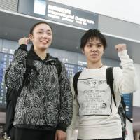 Shoma Uno (right) and Rika Hongo pose for photos at Chubu Centrair International Airport in Nagoya on Monday before leaving for South Korea. | KYODO