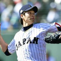 Japan starter Shota Takeda pitches against the Hawks during an exhibition game on Saturday. | KYODO