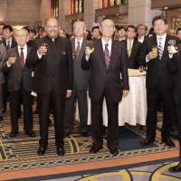 India\'s Ambassador H.E. Sujan R. Chinoy (fifth from left) raises a glass for a toast with Japanese dignitaries and other guests at the 68th Republic Day of India reception at the Hotel Okura in Tokyo on Jan. 26. | INDIAN EMBASSY