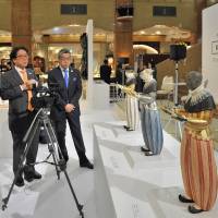 (From left) Tokyo University of the Arts professor Yuji Akimoto; Secretary-General of the Secretariat of the Headquarters for the Tokyo 2020 Olympic and Paralympic Games Takeo Hirata; and President and CEO of Isetan Mitsukoshi Holdings. Ltd. Hiroshi Ohnishi attend a preview of the \"KOGEI Future Forward\" exhibition, which runs through Feb. 20, at the Nihombashi Mitsukoshi Main Building on Feb. 15. | YOSHIAKI MIURA