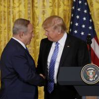 President Donald Trump and Israeli Prime Minister Benjamin Netanyahu hold a news conference at the White House on Wednesday, when Trump dropped the long-standing U.S. commitment to a two-state solution to the Israeli-Palestinian conflict even as he urged Netanyahu to curb the construction of Jewish settlements in the West Bank. | REUTERS