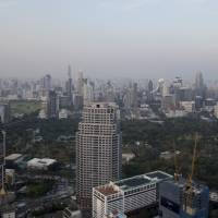 High-rises dot Bangkok\'s skyline. Emerging economies across Asia need to invest up to &#36;26 trillion on infrastructure through 2030 to maintain growth and meet other goals, the Asian Development Bank said in a new report. | BLOOMBERG