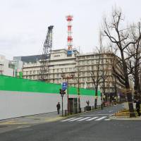 A construction site is seen in Osaka in the city\'s Midosuji district in December. Numerous hotels have been constructed in the area recently. | KYODO