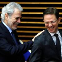 European Commissioner for Humanitarian Aid and Crisis Management Christos Stylianides (left) and European Commission Vice-President Jyrki Katainen attend a meeting of the EU executive body in Brussels March 1. | REUTERS