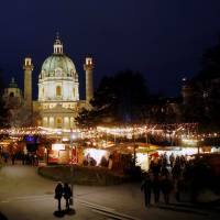 An advent market is seen in front of Karlskirche church in Vienna in December. | REUTERS
