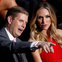Donald Trump\'s son Eric Trump and his wife, Lara, attend the third day of the Republican National Convention in Cleveland last July. | REUTERS