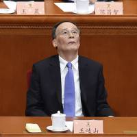 Wang Qishan, a member of the Standing Committee of the Political Bureau of the Communist Party of China Central Committee and secretary of the CPC Central Commission for Discipline Inspection, attends the opening session of the Chinese People’s Political Consultative Conference at the Great Hall of the People in Beijing on Friday. China anti-graft overhaul paves way for Xi to retain ally — and sets precedent for him to stay on beyond 2022