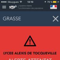 A French police  alert is displayed cell phone in Paris, France, on Thursday. The French government sent out an alert warning of an attack at the Alexis de Tocqueville high school in the southern French town of Grasse. | AP