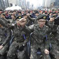 South Korean army soldiers shout slogans against the North Korea during a ceremony in Seoul on Friday to commemorate South Korean soldiers killed in three major clashes with North Korea in the West Sea. According to U.S. defense officials, North Korea is now in the final stages of preparing for yet another nuclear test that could come in the next few days. | AP