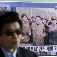 A TV news program shows an image, published in North Korea\'s Rodong Sinmun newspaper, of North Korean leader Kim Jong Un at the country\'s Sohae launch site, at Seoul Railway station in the South Korean capital Sunday. | AP