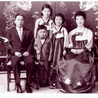 Park Geun-hye (center) poses with her father and president at the time, Park Chung-hee, and her mother, Yuk Young-soo, along with her younger brother and sister in Seoul in this undated photo. South Korea's longtime 'princess' dethroned in disgrace