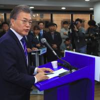 South Korean presidential candidate Moon Jae-in from the Democratic Party speaks during a news conference in Seoul on Sunday. | AFP-JIJI