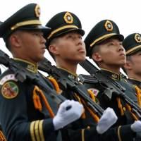 Taiwanese cadets march during a ceremony to mark the 92nd anniversary of the Whampoa Military Academy, in Kaohsiung, Taiwan, last June. | REUTERS
