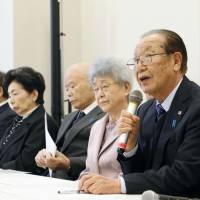 Shigeo Iizuka (right) speaks at a news conference in Tokyo on Thursday with the families of other people abducted by North Korea. Families push Japanese government for more action to bring abductees home from North Korea