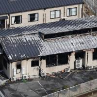 The Hidamari 3 facility in Matsuno, Ehime Prefecture, is seen Sunday morning after a fire gutted the building earlier in the day. | KYODO