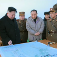 North Korean leader Kim Jong Un points to a map apparently detailing the flight path of a four-missile launch drill Monday in this image taken from YouTube. An analysis by U.S.-based missile experts has said that the map details how U.S. Marine Corps Air Station Iwakuni in Yamaguchi Prefecture was the simulated target of the exercise. | KCNA / VIA REUTERS