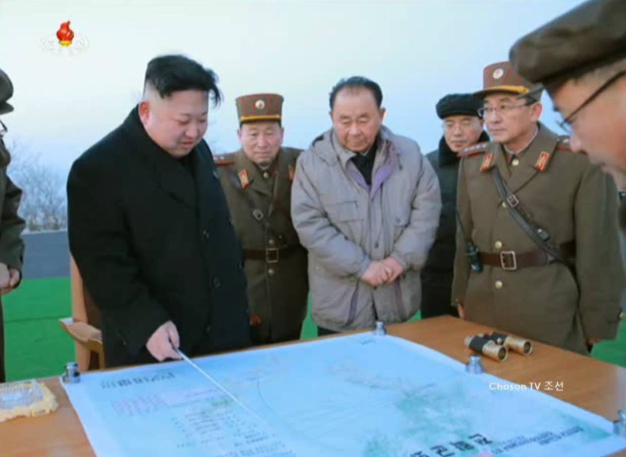 North Korean leader Kim Jong Un points to a map apparently detailing the flight path of a four-missile launch drill Monday in this image taken from YouTube. An analysis by U.S.-based missile experts has said that the map details how U.S. Marine Corps Air Station Iwakuni in Yamaguchi Prefecture was the simulated target of the exercise. | KCNA / VIA REUTERS