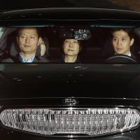 Former President Park Geun-hye is taken to a detention facility near Seoul before dawn Friday after being arrested. Japan presses for stable ties with South Korea in wake of Park arrest and jailing