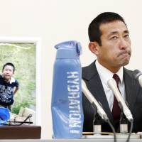 Takatoshi Noritake, who lost his 9-year-old son Keita in an traffic accident caused by a truck driver playing the smartphone game \"Pokemon Go,\" faces the media at a news conference Wednesday in Ichinomiya, Aichi Prefecture, after the driver was sentenced to three years in prison. | KYODO