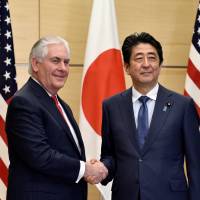 U.S. Secretary of State Rex Tillerson and Prime Minister Shinzo Abe shake hands before their meeting at Abe\'s official residence in Tokyo on Thursday. | REUTERS