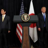 U.S. President Donald Trump and Prime Minister Shinzo Abe leave after delivering remarks on North Korea on Feb. 11 at Trump\'s Mar-a-Lago club in Palm Beach, Florida. | REUTERS