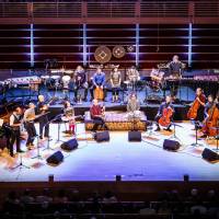 All hands on deck: Yo-Yo Ma (fifth from the right in the front row) and the musicians of the Silk Road Ensemble represent a global array of cultures on stage. | MAX WHITTAKER