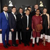 Red carpet: Members of the Silk Road Ensemble arrive at the 59th Grammy Awards on Feb. 12. The ensemble won the award for best world music album. Pictured from left are Johnny  Gandelsman, Reylon Yount, Shane Shanahan, Kojiro Umezaki, Joseph Gramley and, in the front row, Wu Tong, Sandeep Das and Haruka Fujii. | REUTERS
