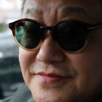 Taxi driver Takehiko Kato rocking one of his many pairs of Tom Ford shades. | KIT NAGAMURA