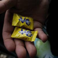 Healthy lemon-flavored treats are taxi driver Takehiko Kato\'s first act of kindness. | KIT NAGAMURA