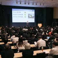 Saito speaks at the Cyber3 Conference Tokyo 2016 in Roppongi, in Tokyo\'s Minato Ward, in November. | INTECUR