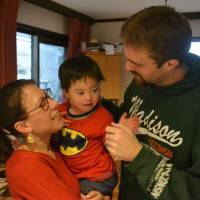 Meet the O\'Briens: Elizabeth and Carl hold their son, Sam, at their home in Sango, Nara Prefecture. | J.J. O\'DONOGHUE