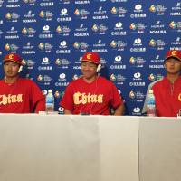China\'s Meng Weiqiang (left), Ray Chang (center) and Ju Kwon speak at a World Baseball Classic news conference in Tokyo on Tuesday. | JASON COSKREY
