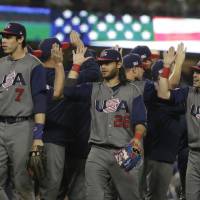 United States celebrates after defeating Japan, 2-1, in a semifinal in the World Baseball Classic in Los Angeles on Tuesday. | AP