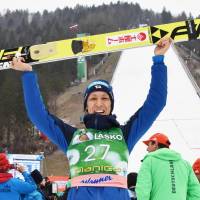 Noriaki Kasaki celebrates after finishing third in a ski jumping World Cup event in Planica, Slovenia, on Sunday. | KYODO