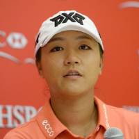 Lydia Ko speaks during a news conference in Singapore on Wednesday. | AFP-JIJI