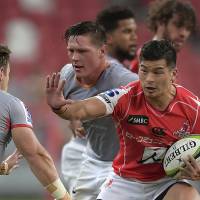 The Sunwolves\' Shota Emi tries to avoid being tackled during his team\'s Super Rugby match against the Southern Kings on Saturday in Singapore. | AP
