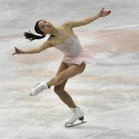 Marin Honda competes during the short program at the world junior championships in Taipei on Friday night. Honda was in second place heading into Saturday\'s free skate. | AFP-JIJI