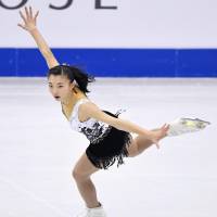 Kaori Sakamoto skates during the short program at the world junior championships in Taipei on Friday night. Sakamoto was in third place ahead of Saturday\'s free skate. | KYODO