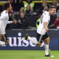 Germany’s Lukas Podolski celebrates his goal against England during a friendly in Dortmund, Germany, on Wednesday. Germany's Podolski produces storybook finish with lone goal in final match of international career