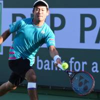 Yoshihito Nishioka plays a shot against Tomas Berdych in their third-round match at the BNP Paribas Open on Monday in Indian Wells, California. | USA TODAY / VIA REUTERS