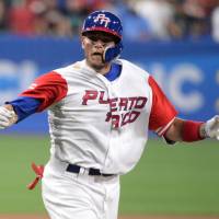 Yadier Molina and his Puerto Rico teammates will face the Netherlands in the semifinals of the 2017 World Baseball Classic at Dodger Stadium in Los Angeles on Monday. | USA TODAY / VIA REUTERS